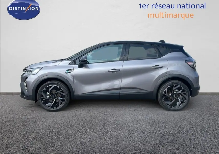 Profil droit d'un Renault Captur E-Tech hybride 2025 gris cassiopée avec toit noir et jantes noires distinctives.