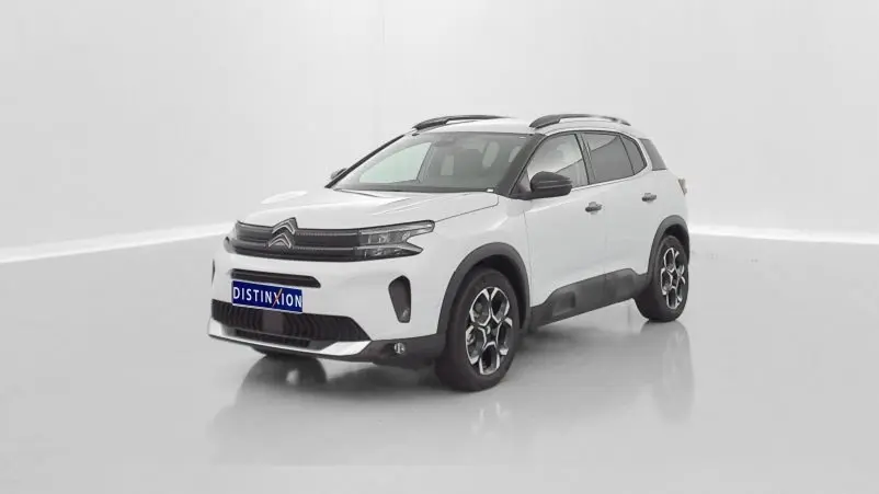 Citroën C5 Aircross hybride blanc en 3/4 avant droit, avec jantes noires et toit noir contrasté.