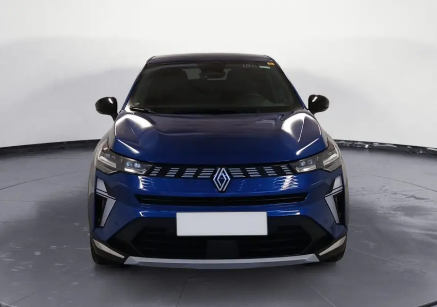 Vue de face du Renault Symbioz E-Tech Full Hybrid 145 Iconic 2025 en bleu Iron avec calandre distinctive et phares LED fins.