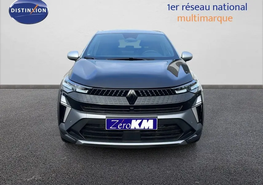 Vue frontale du Renault Captur E-Tech hybride 2025 noir étoile avec toit gris et calandre moderne.