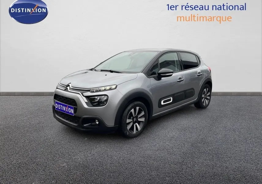 Citroën C3 gris acier métal avec toit noir, vue 3/4 avant droit, soulignant les protections latérales blanches.