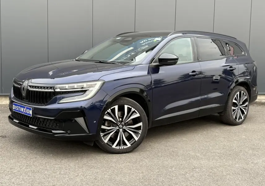 Renault Espace 2023 Bleu Nuit en 3/4 avant droit, avec jantes alliage noires et toit panoramique visible.