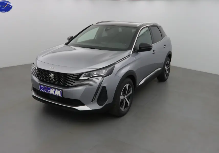 Peugeot 3008 gris Artense métal en vue 3/4 avant droit, avec calandre noire et jantes bicolores.