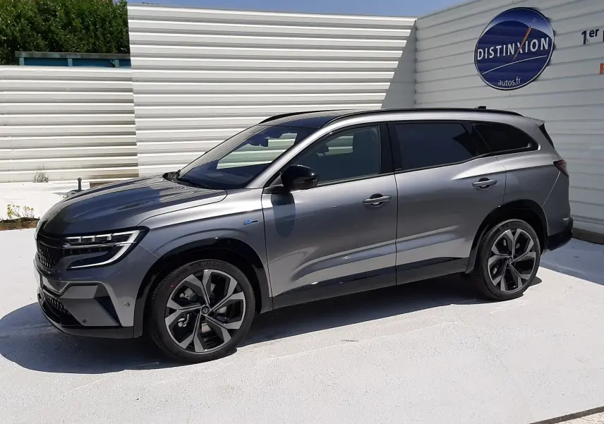 Renault Espace VI gris schiste métal vu de profil côté gauche, avec jantes alliage et toit noir panoramique.