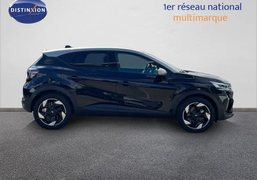 Profil droit du Renault Captur 2025 noir étoile métal avec toit gris, soulignant ses jantes bi-ton et lignes modernes.