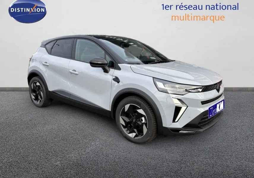 Renault Captur II hybride gris Rafale métal avec toit noir, vue 3/4 avant mettant en valeur ses jantes noires.