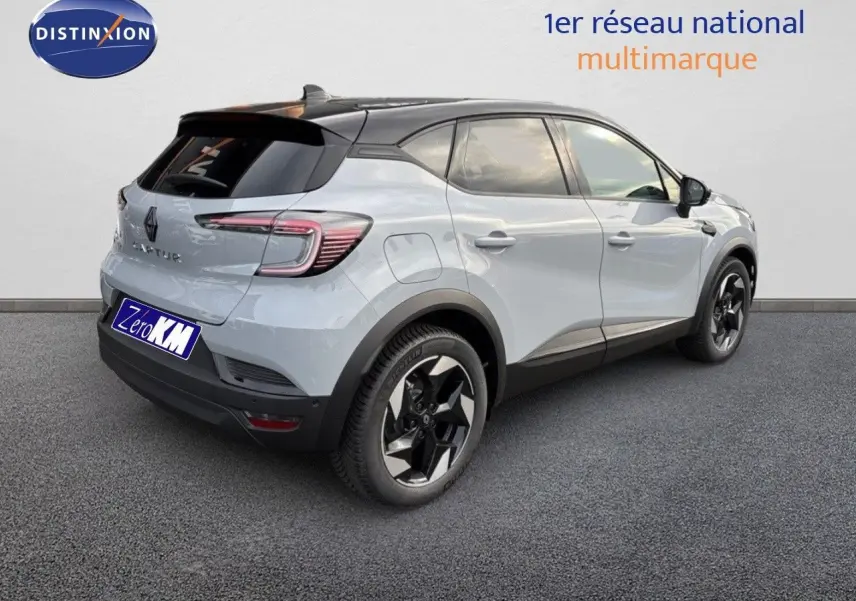 Renault Captur II hybride gris Rafale métal avec toit noir, vue 3/4 arrière droit, jantes noires distinctives.