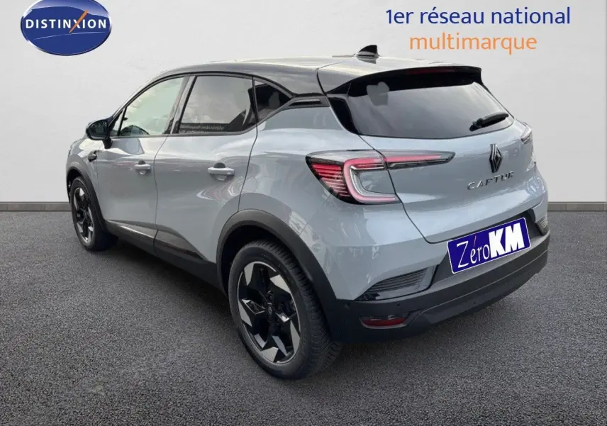 Renault Captur II hybride gris Rafale métal avec toit noir, vue 3/4 arrière droit soulignant ses feux LED et jantes noires.