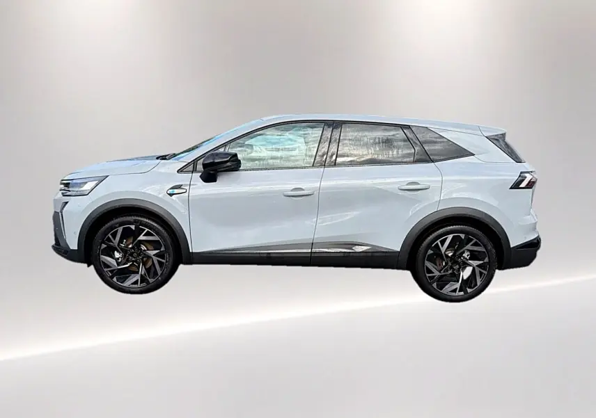 Profil droit du Renault Symbioz gris rafale, SUV hybride avec jantes noires et détails noirs contrastants.