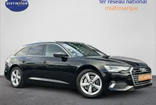 Audi A6 Avant noir métal vue de profil côté gauche, mettant en valeur sa calandre chromée et ses jantes alu cinq branches.