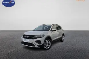 Volkswagen T-Cross gris vue 3/4 avant droit sur sol gris, avec jantes alliage et calandre noire distinctive.