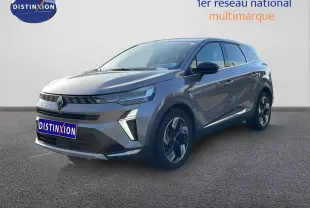 Renault Symbioz gris cassiopée métal en 3/4 avant droit, SUV hybride avec calandre distinctive et jantes bicolores.