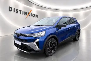 Renault Symbioz 2026 bleu iron en 3/4 avant droit, avec jantes noires et signature lumineuse LED distinctive.