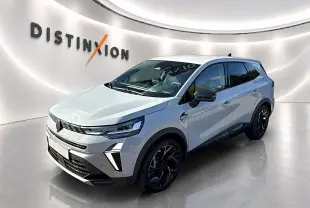 Renault Symbioz gris rafale en 3/4 avant droit, avec jantes noires et calandre distinctive moderne.