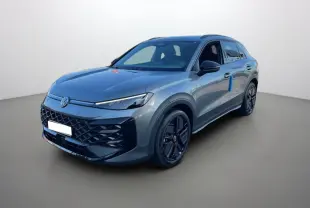 Volkswagen T-Roc gris loup en 3/4 avant droit, avec calandre noire et jantes noires distinctives.
