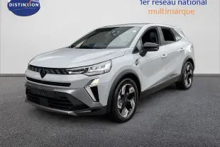 Renault Symbioz gris Rafale métal en 3/4 avant droit, SUV hybride avec phares LED et jantes bicolores distinctives.
