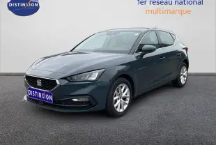 SEAT LEON 2.0 TDI gris magnétique métal, vue 3/4 avant droit, avec jantes alliage et calandre noire.