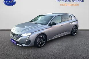 Peugeot 308 gris Artense vue 3/4 avant droit avec phares LED et jantes alliage distinctives.