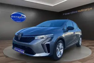 Renault Clio V gris schiste vue 3/4 avant droit, avec feux LED et jantes alliage 16 pouces visibles.