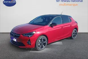 Opel Corsa rouge Kardio métal avec toit noir vue 3/4 avant droit, jantes alliage et phares LED allumés.