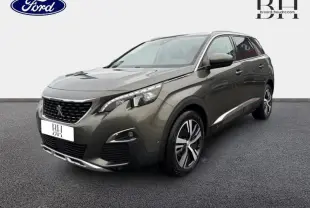 Peugeot 5008 gris Amazonite vue 3/4 avant droit, mettant en valeur ses jantes alliage et son design moderne.