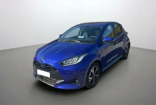Toyota Yaris 1.5 Hybrid 2025 bleu genievre vue 3/4 avant droit avec phares LED et jantes alliage.