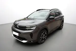Citroën C5 Aircross Hybrid gris platinium en 3/4 avant droit avec barres de toit et jantes alu 18 pouces.