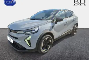 Renault Captur 2025 bleu Iron métallisé en 3/4 avant droit avec jantes noires et feux LED distinctifs.