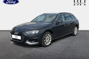 Audi A4 Avant gris Manhattan métallisé vue 3/4 avant droit avec jantes alu et calandre distinctive.