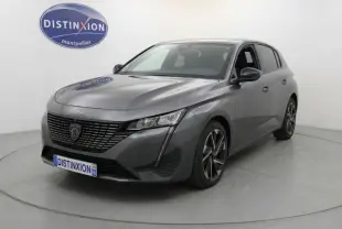 Peugeot 308 Hybrid gris vue 3/4 avant droit, jantes alliage 17 pouces et calandre noire distinctive.