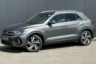 Volkswagen T-Roc 2025 gris Indium en profil droit, avec jantes alliage 18" Nevada et calandre R-Line.