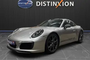Porsche 911 991.2 Carrera T gris GT Silver vue 3/4 avant avec jantes Carrera S 20 pouces et toit ouvrant fermé.