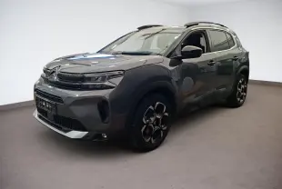 Citroën C5 Aircross gris Platinium en 3/4 avant droit, avec jantes alliage bi-ton et inserts noirs brillants.
