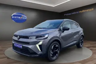 Renault Captur Eco-G 100 Techno gris cassiopée toit noir, vue 3/4 avant avec barres de toit et jantes alu noires.