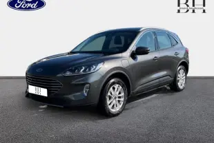 Ford Kuga hybride rechargeable gris métallisé vu en 3/4 avant droit avec jantes alu et phares LED