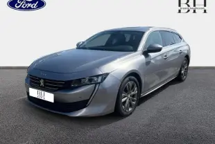 Peugeot 508 SW gris Artense vue 3/4 avant droit, avec calandre chromée et jantes alliage visibles.