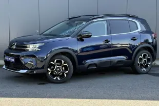 Citroën C5 Aircross Hybrid bleu Eclipse vue de profil côté gauche avec jantes alliage bi-ton et barres de toit noires.