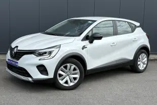 Renault Captur TCE 90 Business blanc nacré en 3/4 avant droit avec jantes alliage et rétroviseurs noirs.
