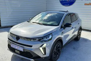 Renault Symbioz E-Tech Full Hybrid gris Rafale, vue 3/4 avant droit, avec calandre noire et jantes noires bicolores.