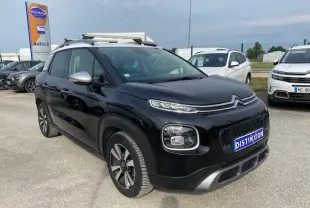 Citroën C3 Aircross noir vue 3/4 avant droit avec toit blanc et jantes alliage distinctives.