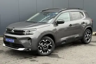 Vue 3/4 avant droite du Citroën C5 Aircross gris Platinium avec jantes alliage bi-ton et toit noir Perla Nera.