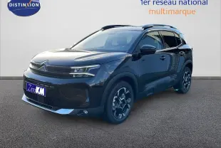 Citroën C5 Aircross noir perla metal en 3/4 avant droit, avec jantes bi-ton et barres de toit visibles.