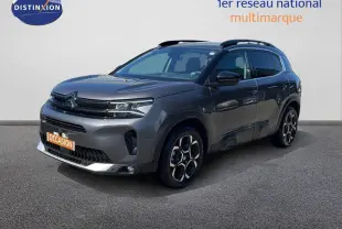 Citroën C5 Aircross gris platinium métal en 3/4 avant droit, avec jantes bi-ton et toit noir contrasté.