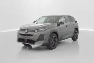 Vue 3/4 avant d'un Citroën C5 Aircross hybride gris platinium avec jantes noires et design moderne épuré.