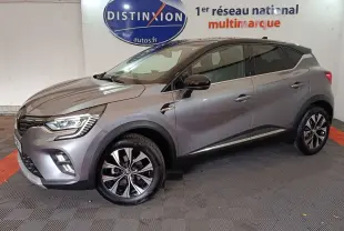 Renault Captur Techno TCe 90 gris foncé en profil droit, avec jantes alliage et feux LED avant visibles.