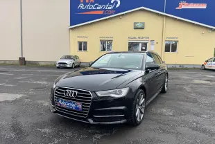Audi A6 Avant noire vue 3/4 avant droit, avec calandre chromée et jantes alliage 19 pouces visibles.