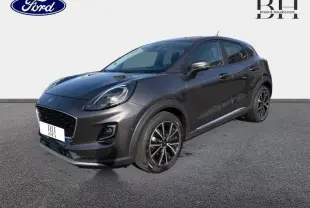 Ford Puma 1.0 EcoBoost 2020 en Fashion Gris Magnetic, vue 3/4 avant droit avec jantes alu noires et vitres teintées.