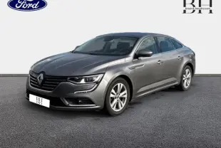 Renault Talisman gris Cassiopée vu en 3/4 avant droit, mettant en valeur ses lignes élégantes et ses jantes alu.
