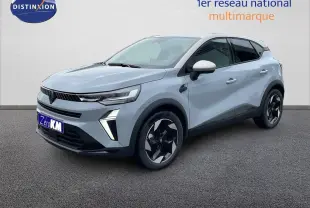 Renault Captur E-Tech hybride gris Rafale, vue 3/4 avant droit avec toit beige et jantes noires bicolores.