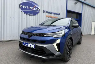 Renault Symbioz bleu iron en 3/4 avant droit, avec calandre noire et jantes noires à design moderne.